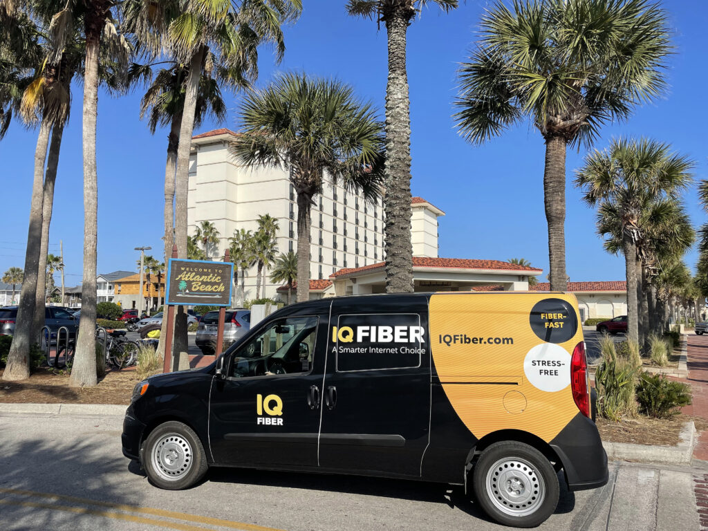 IQ Fiber truck parked in front of the Atlantic Beach welcome sign.