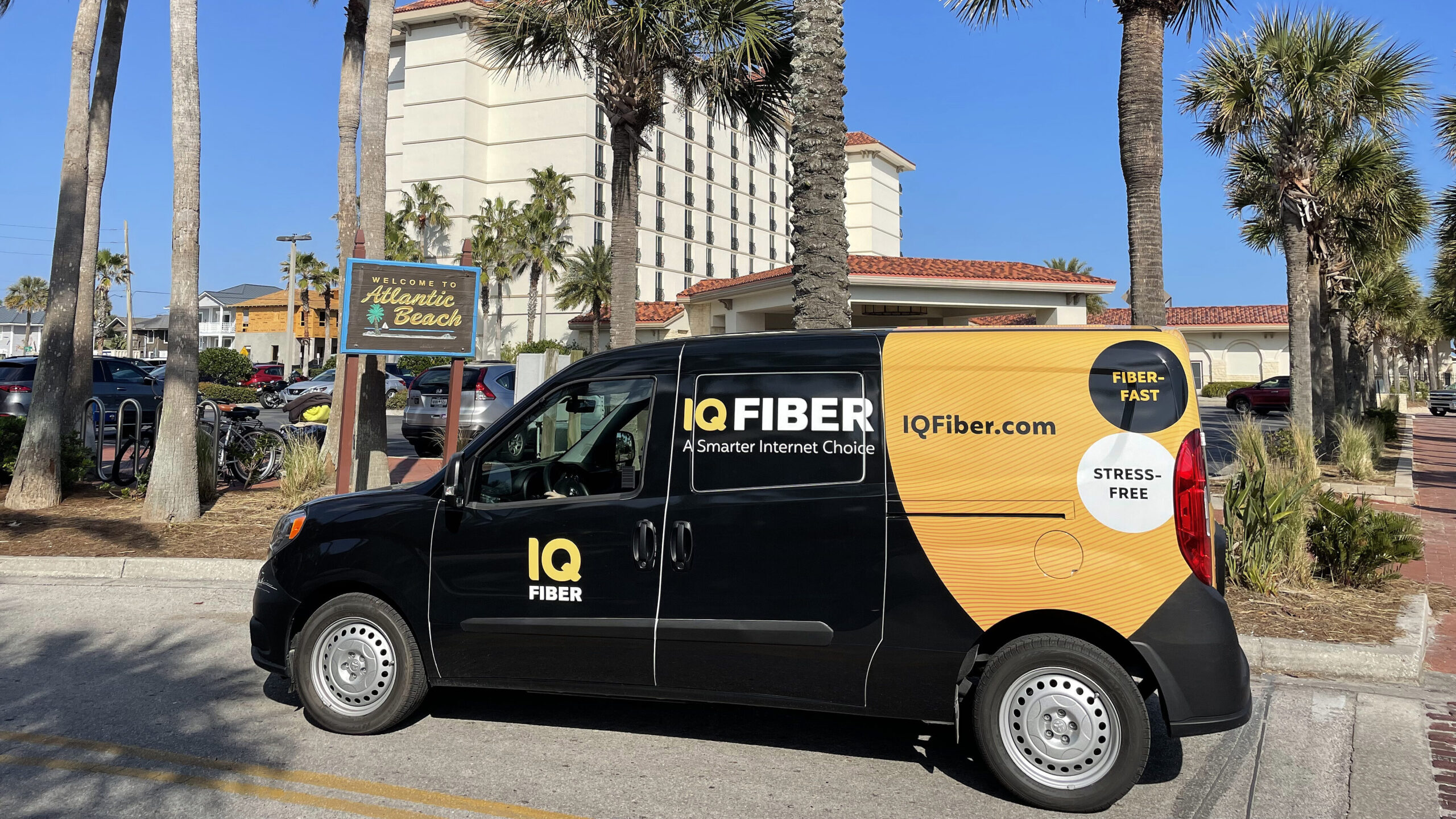 IQ Fiber truck parked in front of the Atlantic Beach welcome sign.