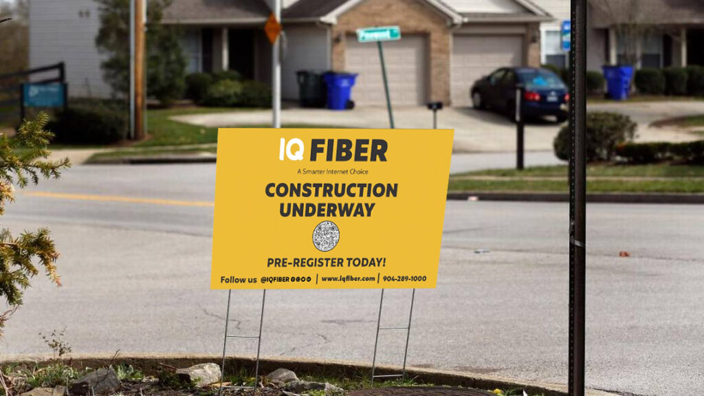 IQ Fiber yard sign stating that construction is underway in the area.