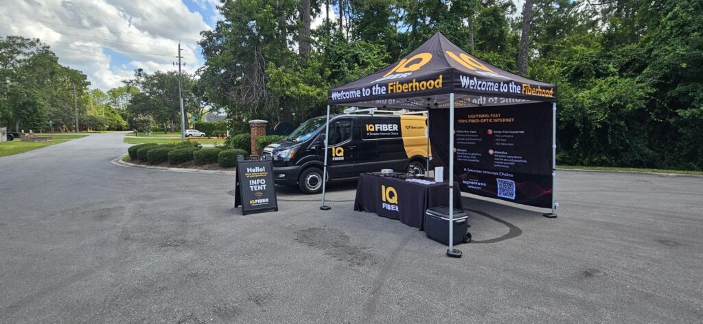 IQ FIber tent at a local event, spreading the word about fiber internet