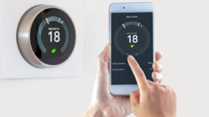 Smart,thermostat,with,a,person,saving,energy,with,a,smart