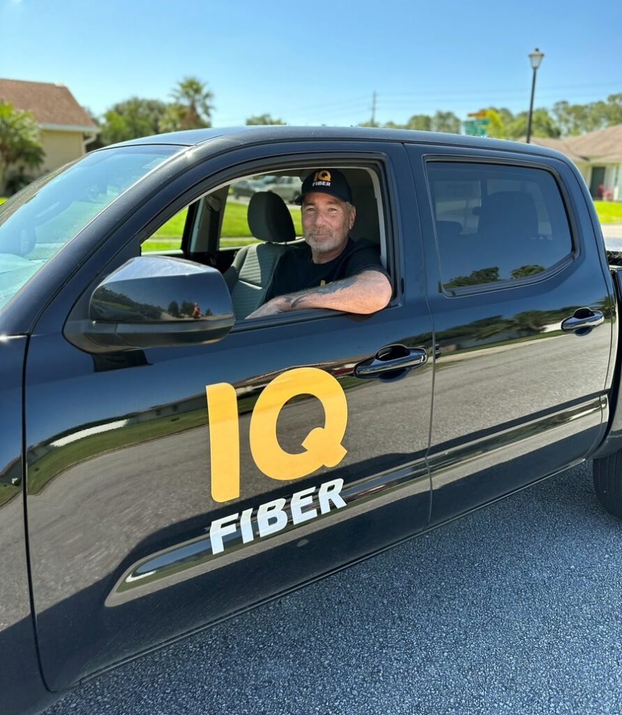 Picture of construction coordinator sitting in an IQ Fiber truck.