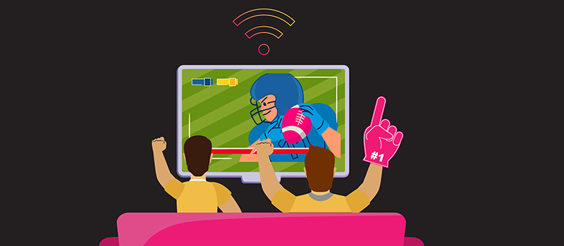 Two fans watching a football game while connected to fiber-optic internet