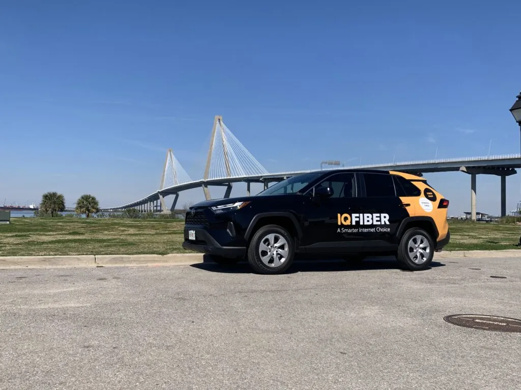 IQ Fiber Internet Service provider in Charleston parked by Arthur Ravenel bridge in Charleston